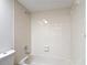 Close up of bath and shower combination in the bathroom at 1041 Bowsprit Ln # 1041, Holiday, FL 34691