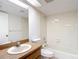 This bathroom features a shower and bath combination and a wood vanity at 1041 Bowsprit Ln # 1041, Holiday, FL 34691