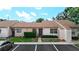 Inviting townhouse with tidy landscaping, beige stucco, and convenient parking at 1041 Bowsprit Ln # 1041, Holiday, FL 34691