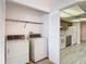 Laundry room with separate washer and dryer next to kitchen at 1041 Bowsprit Ln # 1041, Holiday, FL 34691