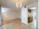 Open-concept living space featuring modern lighting and wood-look floors at 1041 Bowsprit Ln # 1041, Holiday, FL 34691