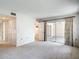 Open living room with sliding glass doors to the patio at 1041 Bowsprit Ln # 1041, Holiday, FL 34691