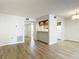 Open floor plan of the living room, flowing into the dining and kitchen areas at 1041 Bowsprit Ln # 1041, Holiday, FL 34691