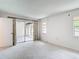 Bright living room with natural light and sliding glass doors at 1041 Bowsprit Ln # 1041, Holiday, FL 34691
