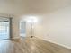 Bright living room with wood-look tile flooring and sliding glass door access at 1041 Bowsprit Ln # 1041, Holiday, FL 34691