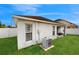 View of the backyard and the side of the home with an AC unit at 10739 Shady Preserve Dr, Riverview, FL 33579