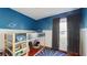 Bright bedroom with a bunk bed, and space-themed decor at 10739 Shady Preserve Dr, Riverview, FL 33579