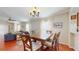 Charming dining room with stylish decor, a wooden table, and comfortable seating at 10739 Shady Preserve Dr, Riverview, FL 33579