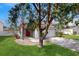 Attractive single-Gathering home with a two-car garage, lush lawn, and inviting red front door at 10739 Shady Preserve Dr, Riverview, FL 33579