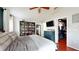 Spacious primary bedroom featuring hardwood floors, a ceiling fan, and a walk-in closet at 10739 Shady Preserve Dr, Riverview, FL 33579