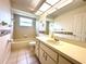 Clean bathroom featuring a shower/tub combo and a neutral vanity, blending functionality with style at 10806 Brookhaven Dr, New Port Richey, FL 34654