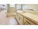 Traditional bathroom with a single sink vanity, large mirror, and tile flooring at 10806 Brookhaven Dr, New Port Richey, FL 34654