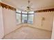 Bright bedroom with a bay window and ceiling fan offering natural light and comfortable living at 10806 Brookhaven Dr, New Port Richey, FL 34654