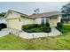 Charming one-story home with a well-maintained lawn, two-car garage, and inviting landscaping at 10806 Brookhaven Dr, New Port Richey, FL 34654