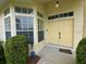 Inviting front entrance featuring double doors and large windows for natural light at 10806 Brookhaven Dr, New Port Richey, FL 34654