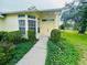 Inviting front entrance with a well-manicured lawn and lush landscaping at 10806 Brookhaven Dr, New Port Richey, FL 34654