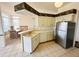 Bright, airy kitchen with stainless steel appliances, ample counter space, and a breakfast bar overlooking dining area at 10806 Brookhaven Dr, New Port Richey, FL 34654