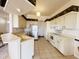 Spacious kitchen with stainless steel appliances, ample counter space, and tiled flooring at 10806 Brookhaven Dr, New Port Richey, FL 34654