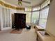 Home office space with a desk, chair, built-in shelving, and large windows at 10806 Brookhaven Dr, New Port Richey, FL 34654