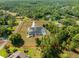 Aerial view displaying landscaped property with pool and boundary outlined in red at 11137 Woodland Waters Blvd, Weeki Wachee, FL 34613