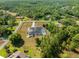 Overhead shot of landscaped property featuring a pool, and a boundary outlined in red at 11137 Woodland Waters Blvd, Weeki Wachee, FL 34613