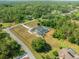 Aerial view highlights property with landscaping, pool, and perimeter boundary at 11137 Woodland Waters Blvd, Weeki Wachee, FL 34613
