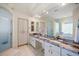 Bathroom features a granite countertop, double sinks and a glass shower at 11137 Woodland Waters Blvd, Weeki Wachee, FL 34613