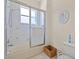 This bathroom features a bathtub with glass sliding doors, and tiled floors at 11137 Woodland Waters Blvd, Weeki Wachee, FL 34613