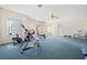 Large carpeted bonus room with exercise equipment and plenty of natural light at 11137 Woodland Waters Blvd, Weeki Wachee, FL 34613