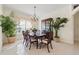 Formal dining room featuring elegant chandelier, large window, and classic furniture at 11137 Woodland Waters Blvd, Weeki Wachee, FL 34613