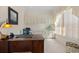 Bright home office featuring custom built-ins, a spacious desk, and abundant natural light, perfect for productivity at 11137 Woodland Waters Blvd, Weeki Wachee, FL 34613