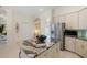 Kitchen with an island with granite countertops, stainless appliances, and views to the adjoining room at 11137 Woodland Waters Blvd, Weeki Wachee, FL 34613