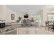 Kitchen with stainless steel appliances, granite countertops, and an open design to the living area at 11137 Woodland Waters Blvd, Weeki Wachee, FL 34613
