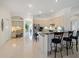 Spacious kitchen with large island, stainless steel appliances, and tile floors at 11137 Woodland Waters Blvd, Weeki Wachee, FL 34613