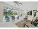 Spacious screened-in lanai with outdoor seating and dining areas overlooking the pool at 11137 Woodland Waters Blvd, Weeki Wachee, FL 34613