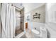 Bright bathroom featuring tiled shower with glass door and modern fixtures at 112 W Mohawk Ave, Tampa, FL 33604