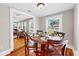 Cozy dining room with hardwood floors, a round table, and seating for four at 112 W Mohawk Ave, Tampa, FL 33604
