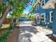 View of home's gated driveway, garage and partial home exterior at 112 W Mohawk Ave, Tampa, FL 33604
