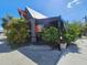 Exterior of a vintage-themed restaurant, featuring foliage and a covered patio at 112 W Mohawk Ave, Tampa, FL 33604