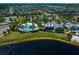 Aerial view of a community with a lakefront pool, clubhouse, and lush green spaces, offering a vibrant lifestyle at 11550 Lake Lucaya Dr, Riverview, FL 33579