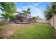 Expansive backyard with lush lawn, enclosed pool, and meticulous landscaping for outdoor enjoyment and relaxation at 11550 Lake Lucaya Dr, Riverview, FL 33579