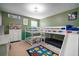 A well-lit bedroom showcasing a playful room, featuring a bunk bed with a slide and fun decor at 11550 Lake Lucaya Dr, Riverview, FL 33579