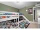 Fun bedroom featuring bunk beds with a slide, and comic-themed decor at 11550 Lake Lucaya Dr, Riverview, FL 33579