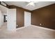 Neutral bedroom with ceiling fan, carpet flooring, and closet offers a serene and comfortable space at 11550 Lake Lucaya Dr, Riverview, FL 33579