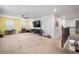 Spacious bonus room with ample space for play and entertainment, featuring a large TV and stair access at 11550 Lake Lucaya Dr, Riverview, FL 33579