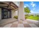 Clubhouse entrance with striking architecture, providing a welcoming space with tiled floors and tropical foliage at 11550 Lake Lucaya Dr, Riverview, FL 33579