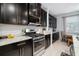 Well-equipped kitchen showcasing stainless steel appliances and beautiful countertops at 11550 Lake Lucaya Dr, Riverview, FL 33579
