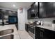 Stylish kitchen with stainless steel appliances, granite countertops and modern fixtures at 11550 Lake Lucaya Dr, Riverview, FL 33579