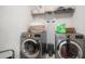 Functional laundry room equipped with modern washer and dryer, maximizing efficiency and convenience at 11550 Lake Lucaya Dr, Riverview, FL 33579