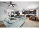 Spacious living area seamlessly blending the kitchen, dining, and living spaces, ideal for modern living at 11550 Lake Lucaya Dr, Riverview, FL 33579